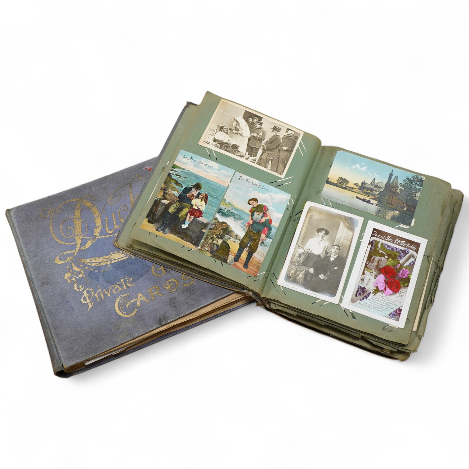 A collection of various postcards in two albums